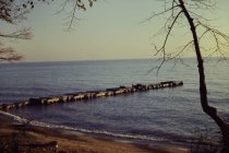 View of damaged long concrete pier